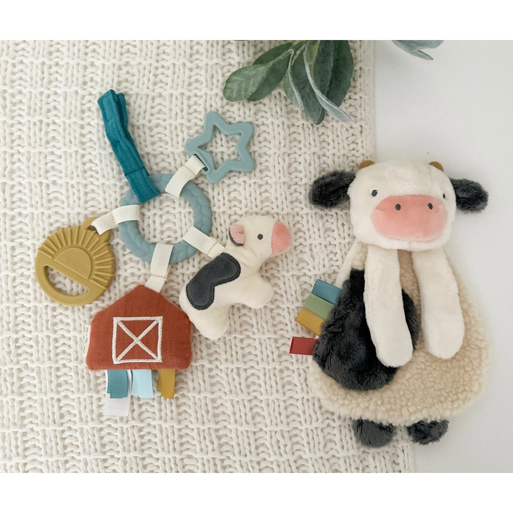 Itzy Ritzy Bitzy Busy Gift Set with plush cow, star teether, and ribbon barn toy (3-piece set)