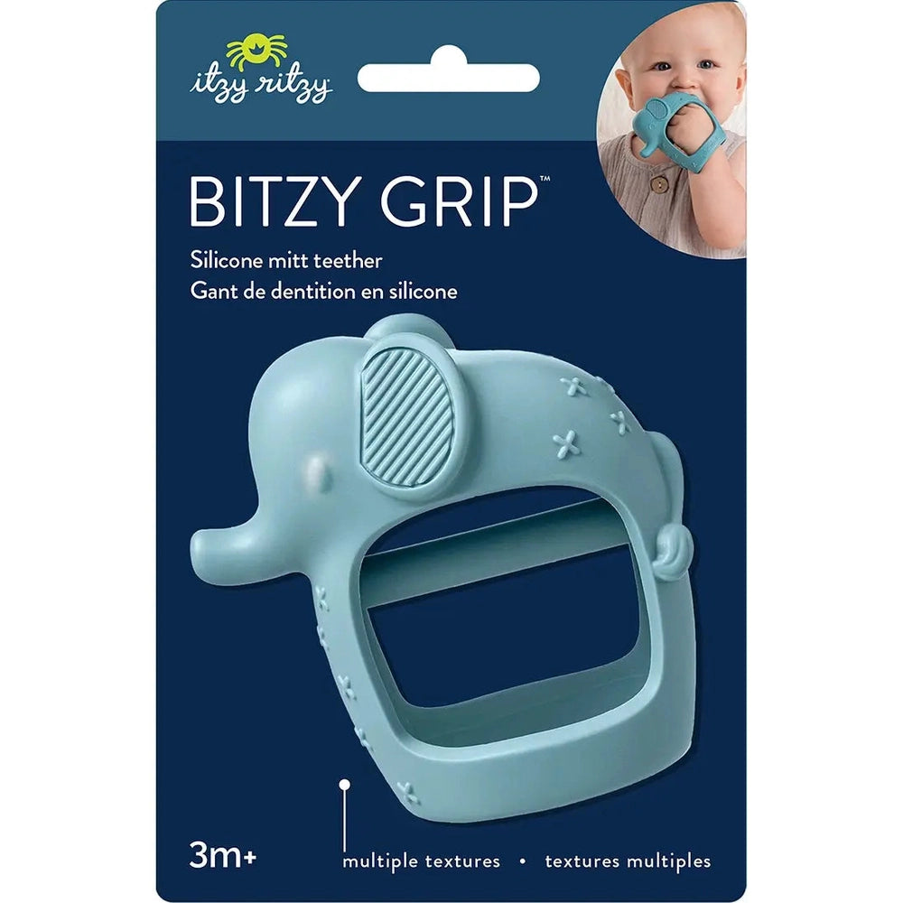 ITZY RITZY Bitzy Grip silicone mitt teether in blue elephant design, worn on a baby's hand showing textured surfaces