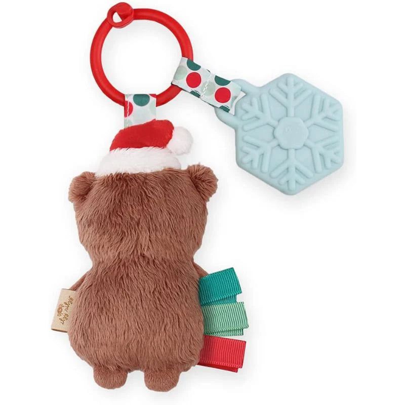 Itzy Ritzy Holiday Itzy Pal Plush Teether: brown bear with Santa hat, attached red ring and blue snowflake teether.