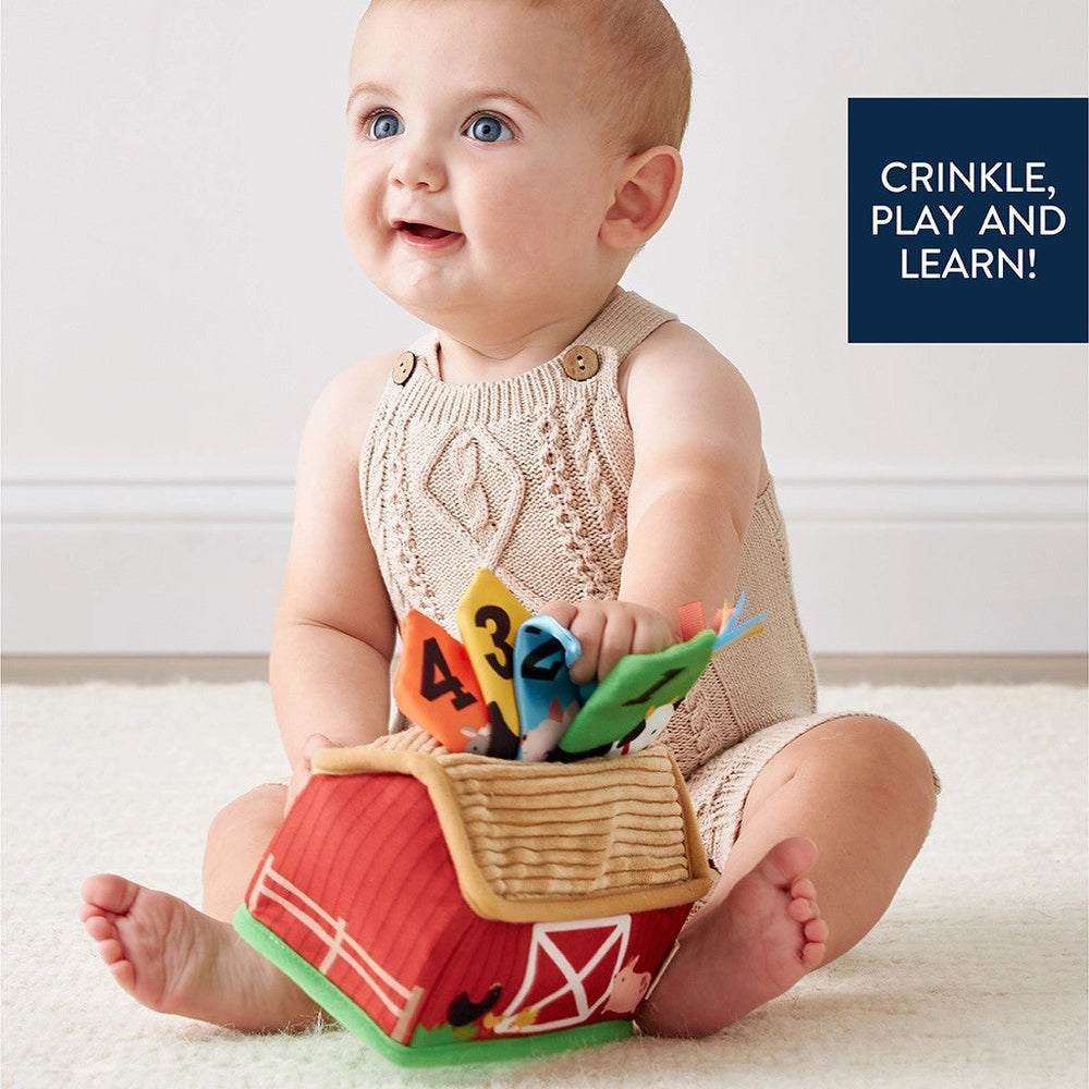 Itzy Ritzy Sensory Scarves baby toy with colorful numbered scarves in a barn basket