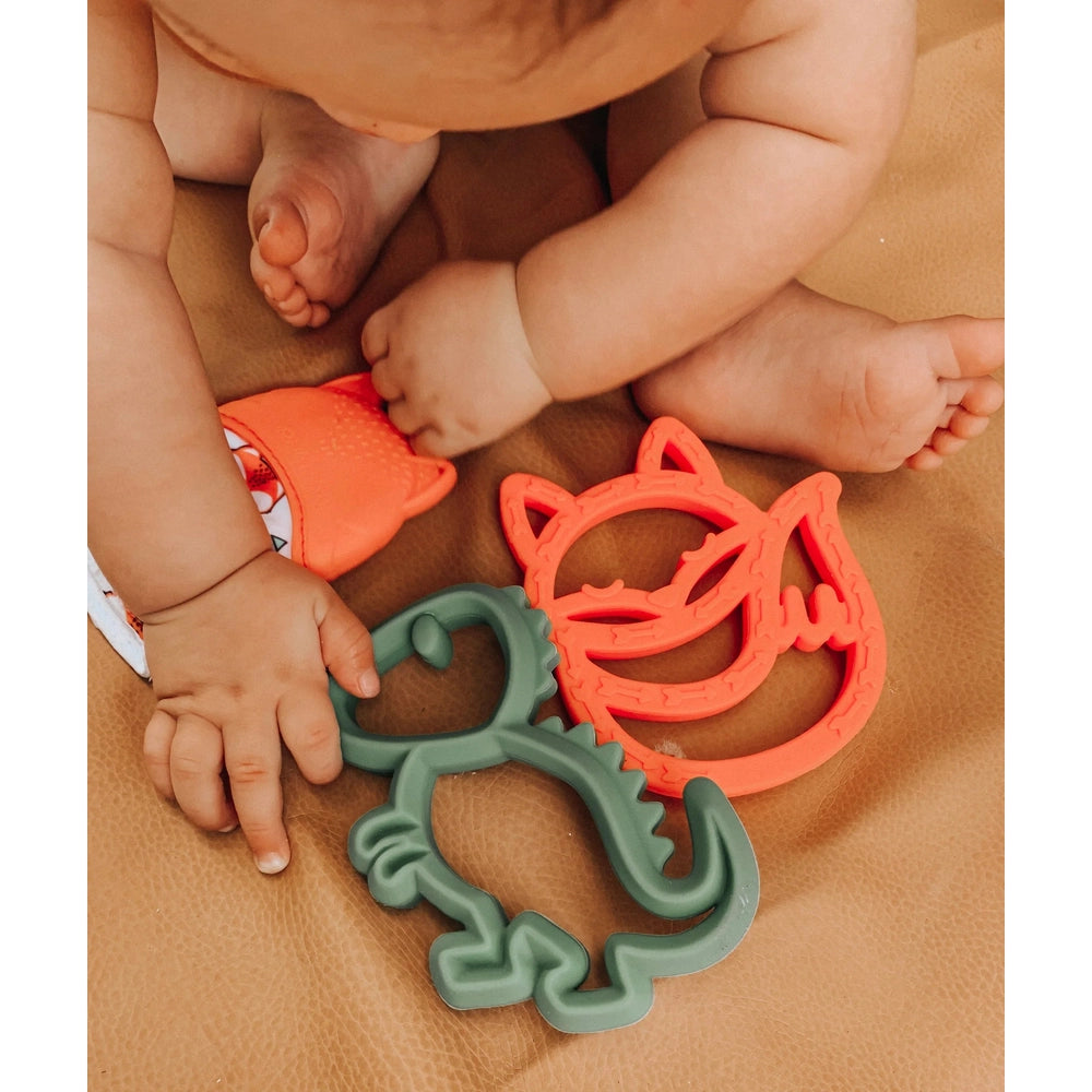 Itzy Ritzy silicone teether set, two animal-shaped teethers in green and coral red.