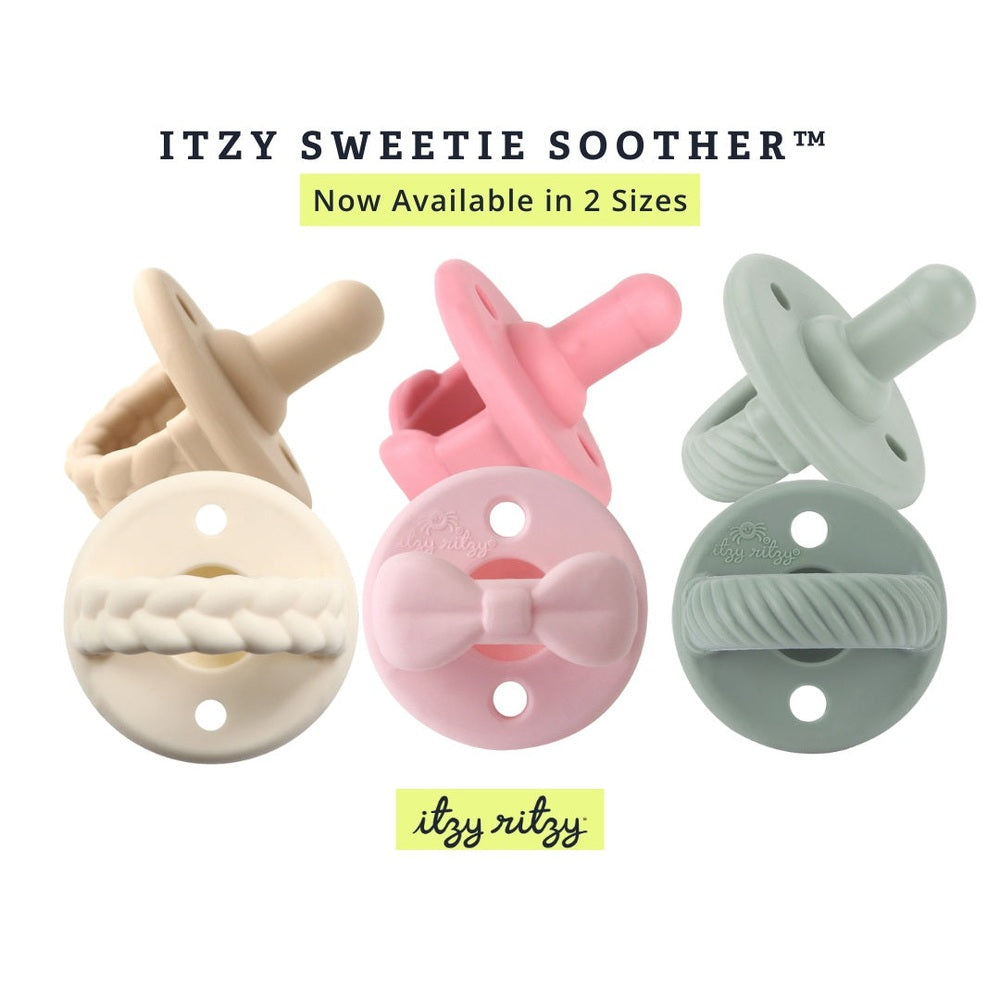 Itzy Ritzy Sweetie Soother Pacifier Sets 2 Pack (6-18M) in beige, pink, sage, showing soft silicone nipples for soothing babies.