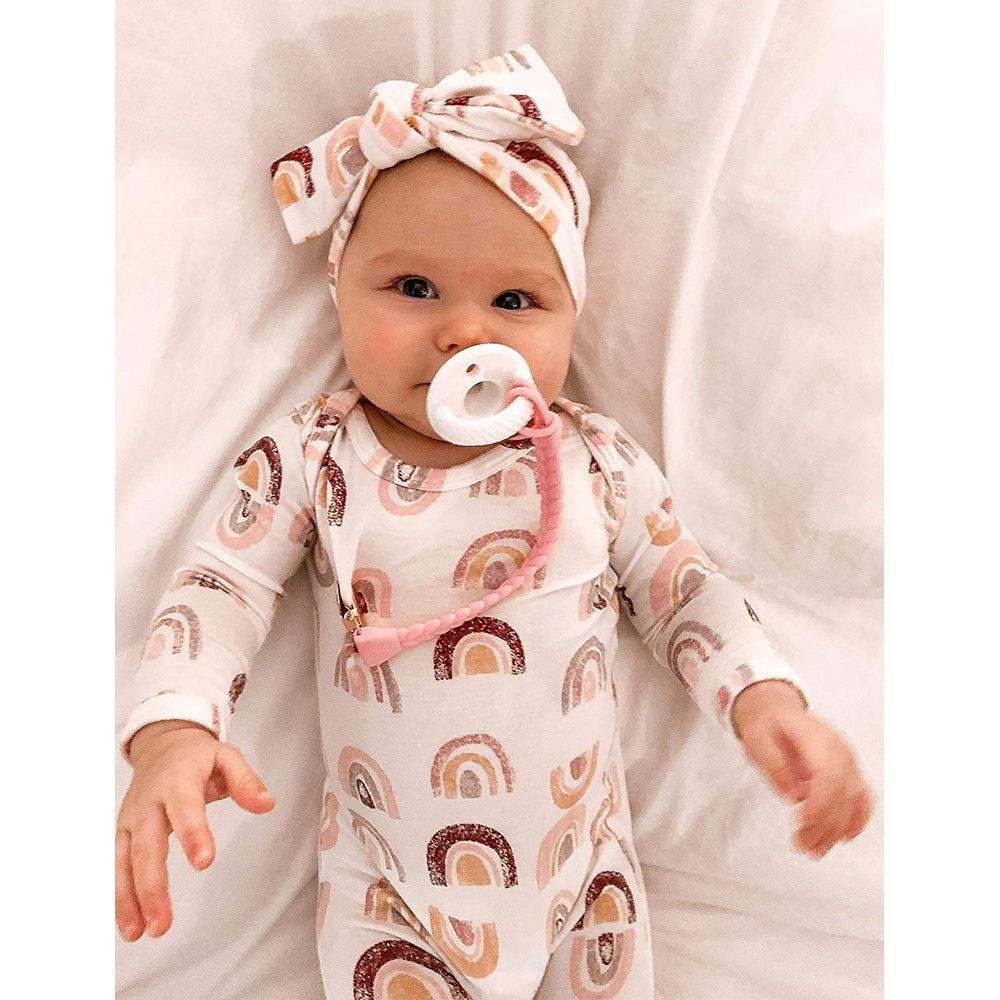 Itzy Ritzy Sweetie Strap braided pacifier clip, pink braided strap with pastel rainbow print onesie
