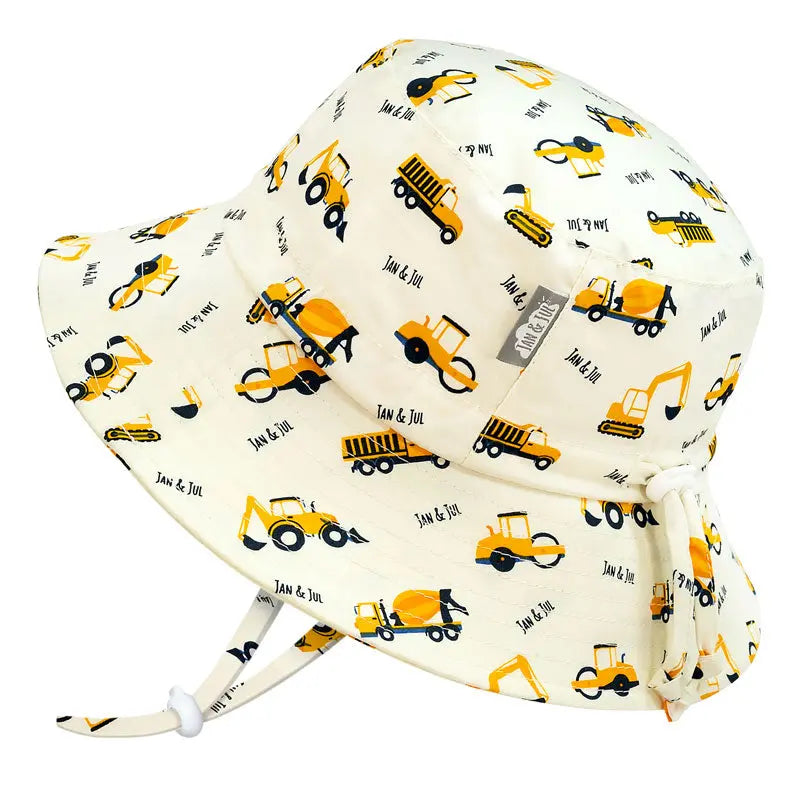 Jan & Jul Kids Cotton Bucket Hat Little Diggers, cream with yellow construction vehicle print and chin tie fastened