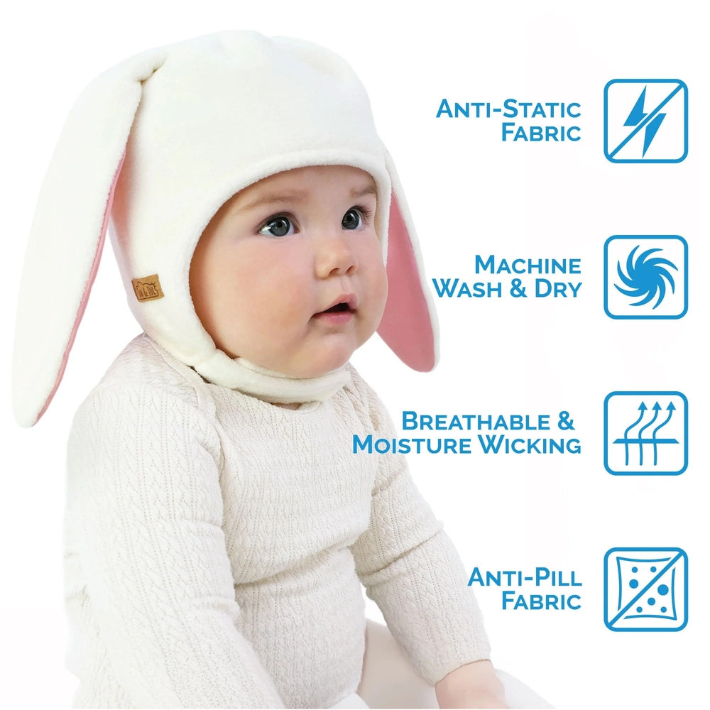 Jan & Jul Kids Fleece Animal Cream Bunny hat on a baby, long ears flopping, keeping little one warm.