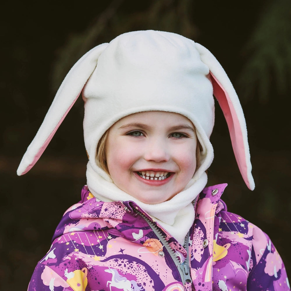 Jan & Jul Kids Fleece Animal Cream Bunny hat worn by smiling toddler; cream fleece with pink-lined floppy ears