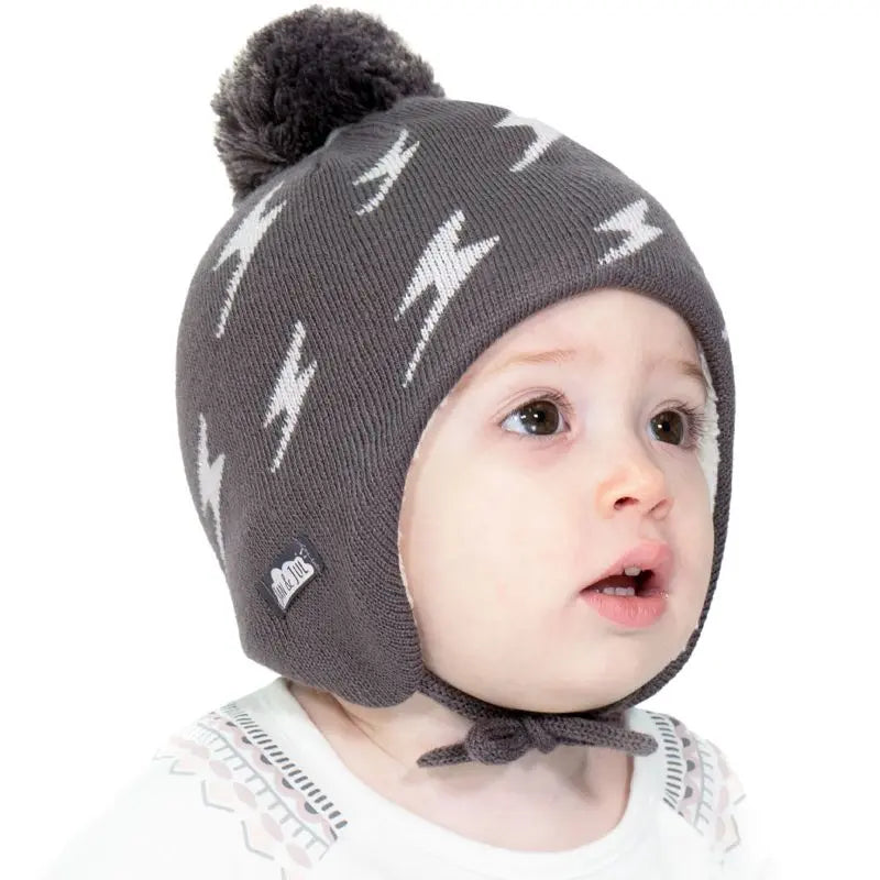 JAN & JUL Kids Knitted Beanies Hat Grey Lighting Bolt pattern with pom-pom, worn by baby.