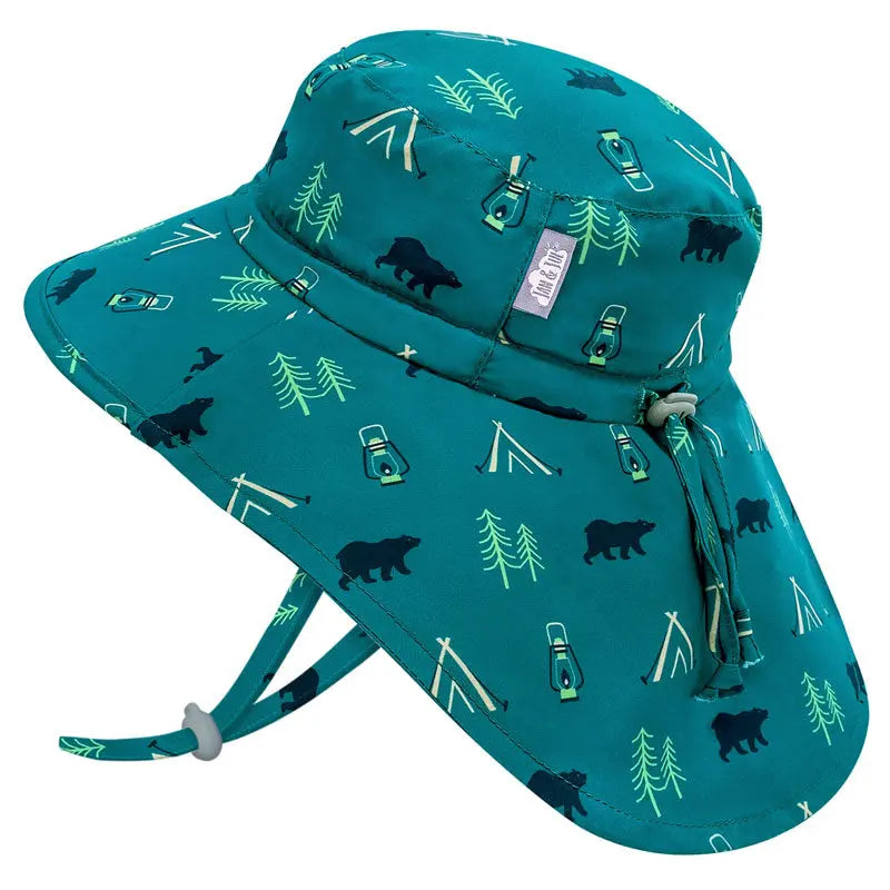 JAN & JUL Kids Water Repellent Adventure Hat, teal with camp icons, adjustable chin strap in use.
