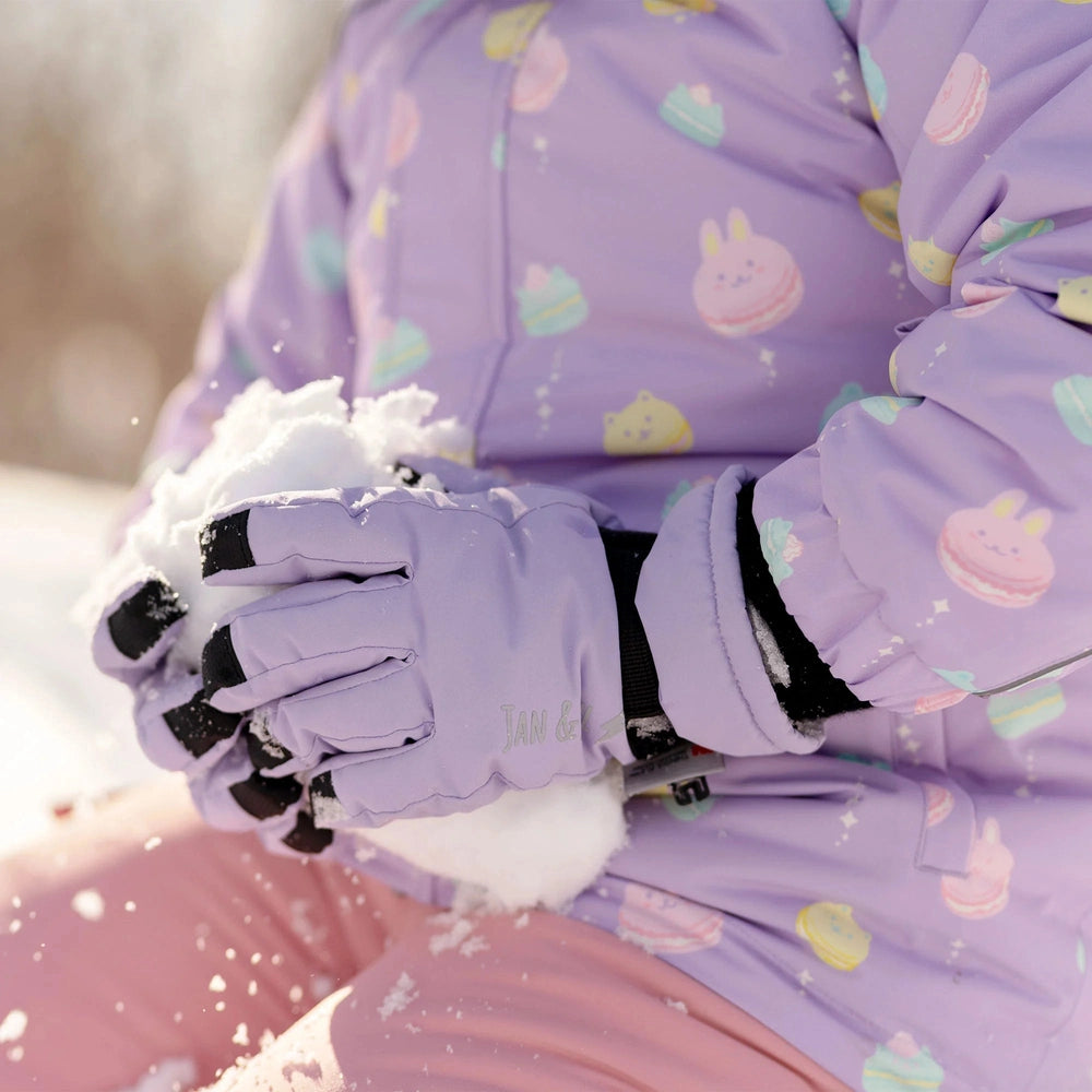 JAN & JUL Kids Waterproof Snow Gloves Neon Peaks lavender, child holds snow in gloved hands.