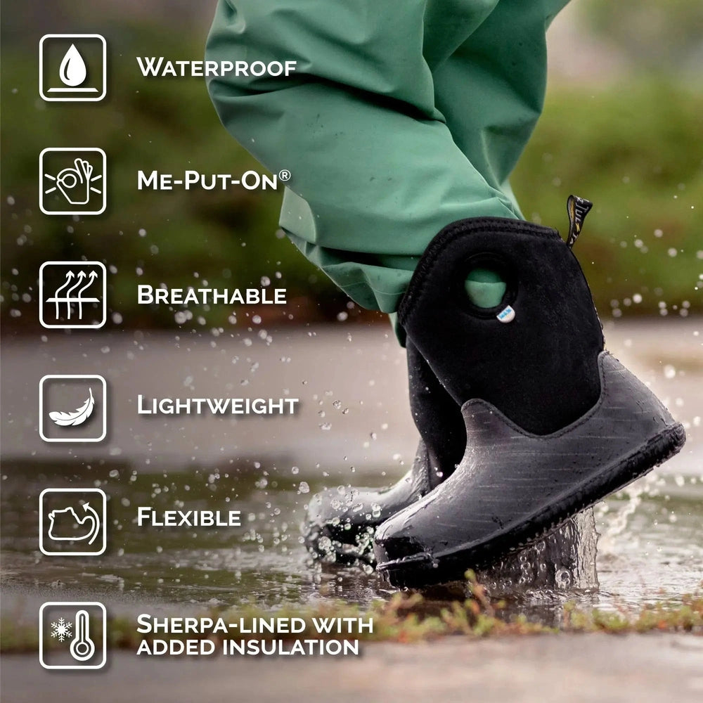 JAN & JUL Toasty Dry Lite Baby Winter Boots Black Birch, waterproof and sherpa-lined; child steps through water.