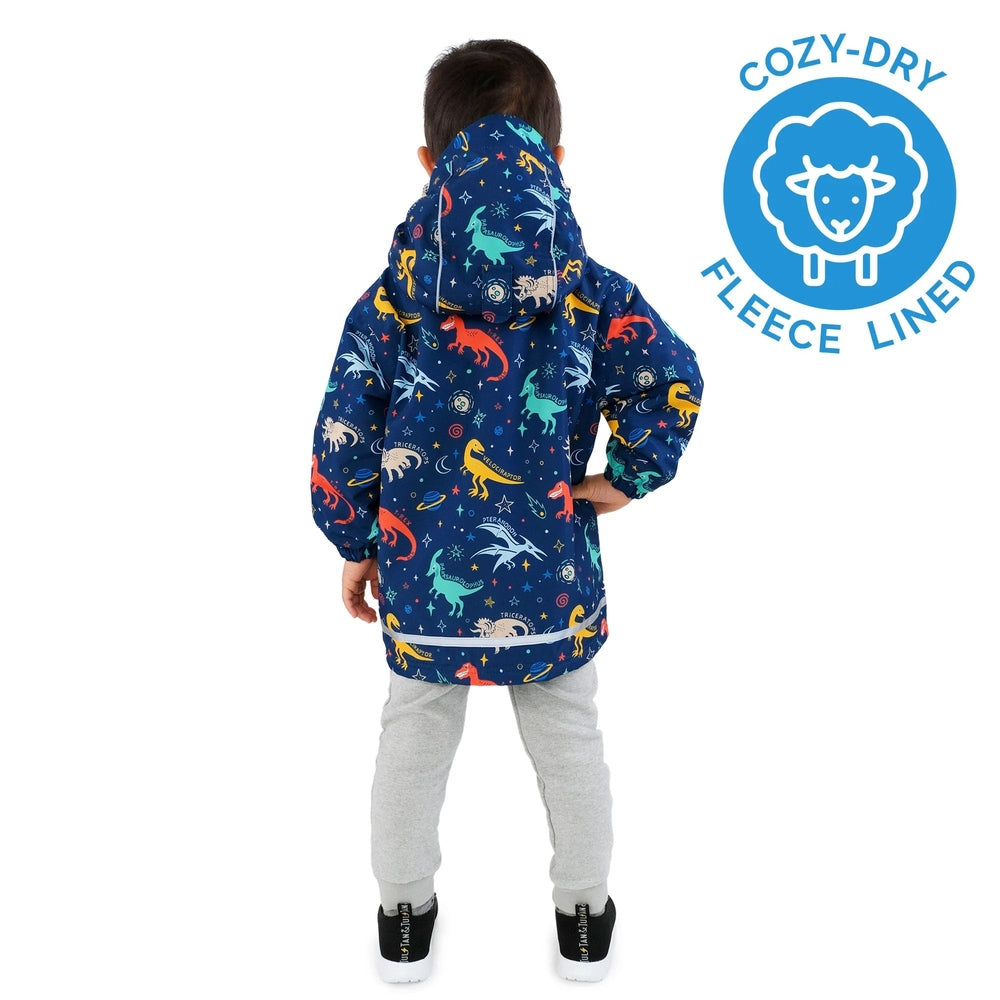 Jan & Jul Waterproof Cozy Dry Rain Jacket Space Dinos, blue fleece-lined hooded coat; child wears hood up.