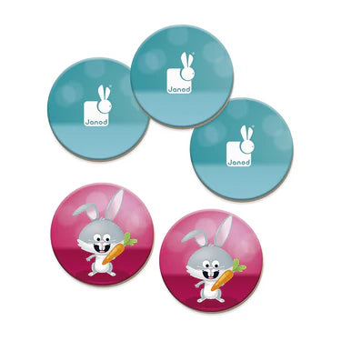 Janod Memo Rigolooo round game pieces: teal logo tokens and pink bunny cards, JANOD branding visible.