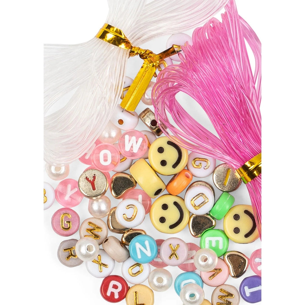 Konges Slojd Abc Jewellery Set: colorful letter beads and smiley charms on pink/white cords, ready to string.