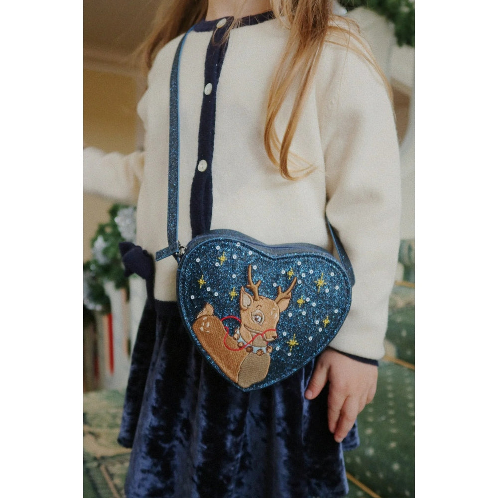 Konges Slojd Alette Cardigan Etoile: cream knit with navy trim and white buttons worn by a child.
