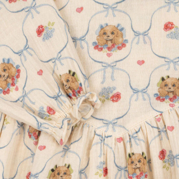 Konges Slojd Coco Dress, cream GOTS cotton with blue bow lattice and puppy prints