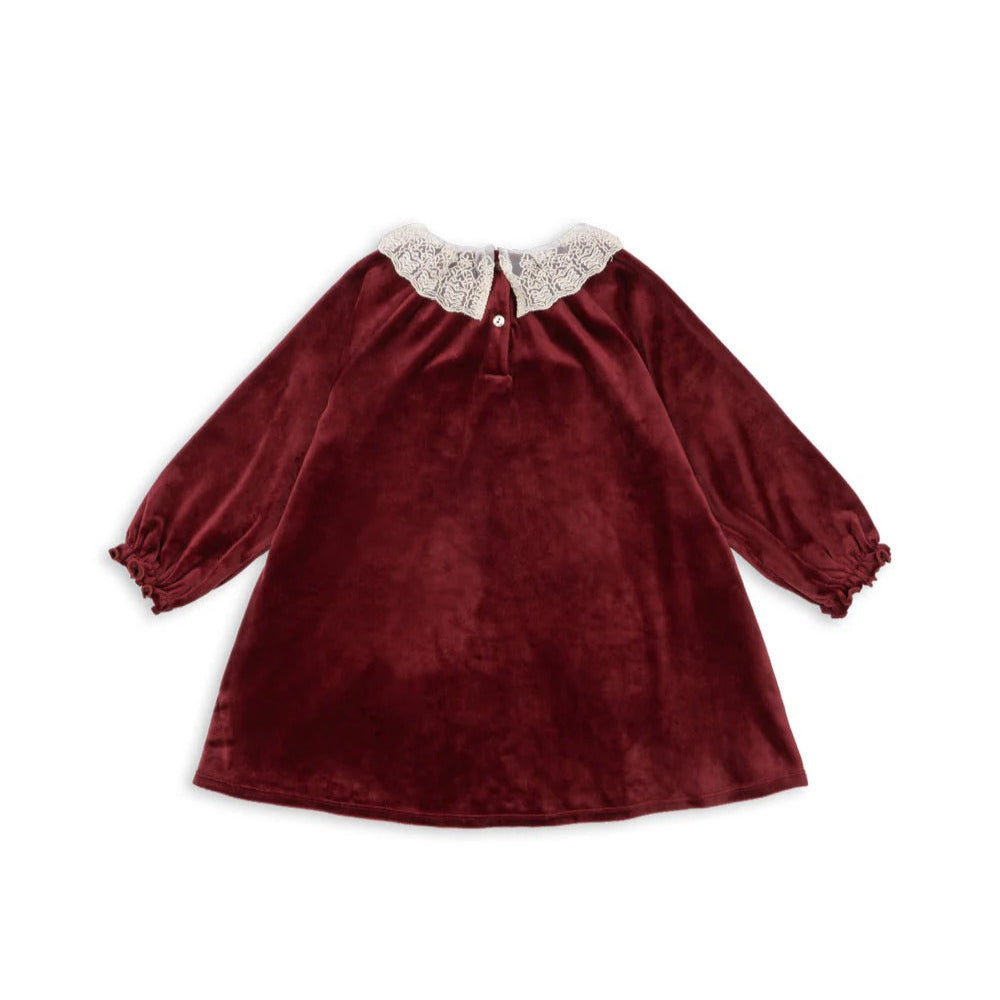 Konges Slojd Venola Dress Red Dahlia, burgundy velvet baby dress with white lace collar and puff sleeves.