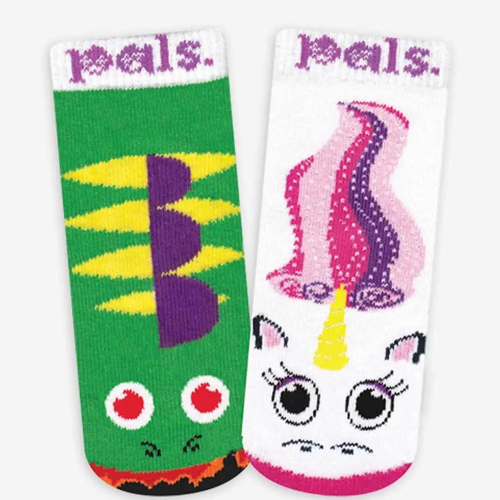 Lil Besties mismatched socks gift box: green zigzag sock on left and white unicorn sock on right, by PALS SOCKS.