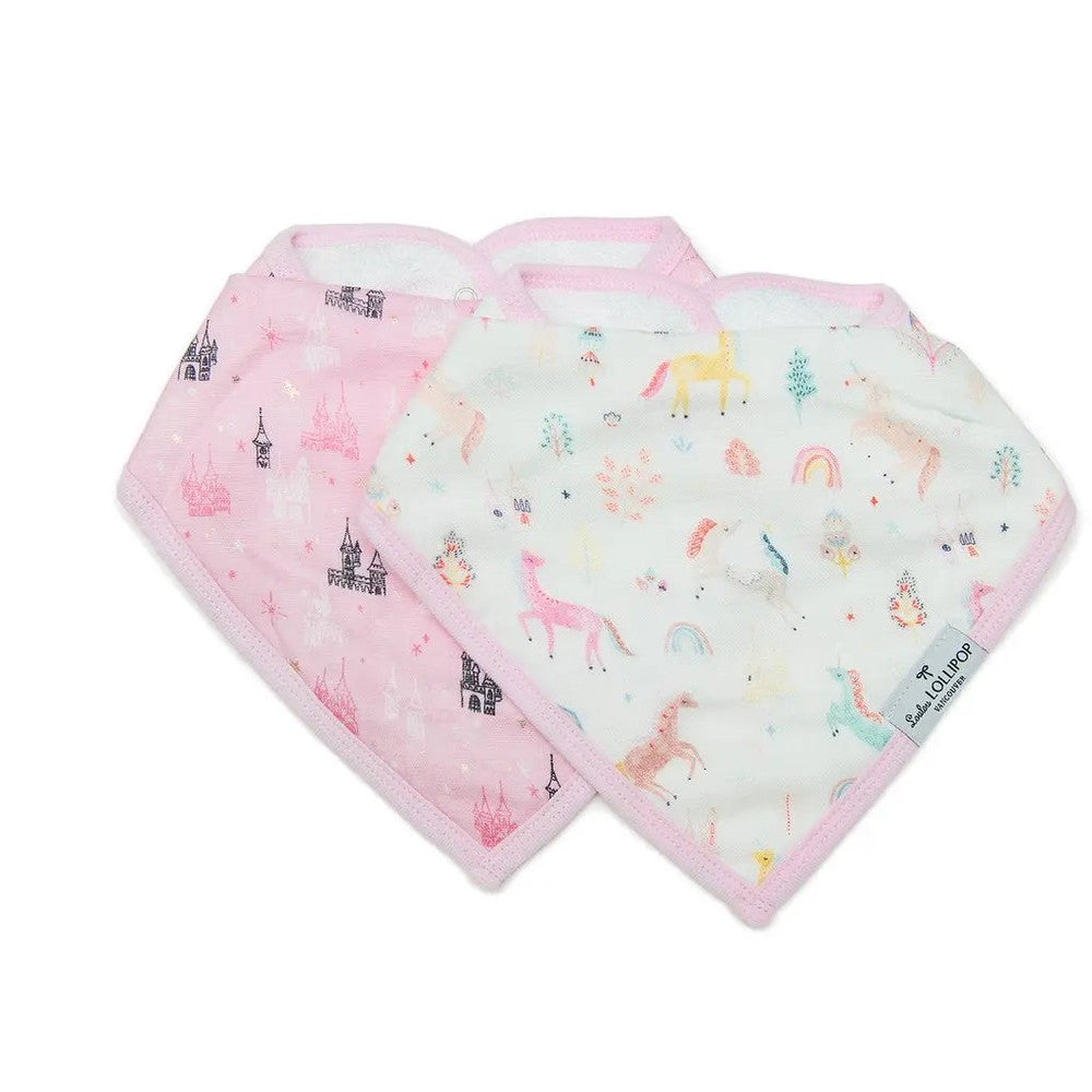 Loulou Lollipop Bandana Bib Set; two pastel bibs with unicorn and castle prints laid flat for mealtime.