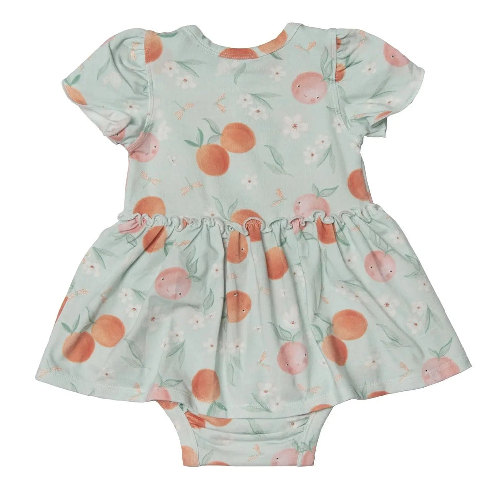 Loulou Lollipop Bodysuit Dress Peaches in mint with peach prints and a ruffled skirt, laid flat with snap bottom.