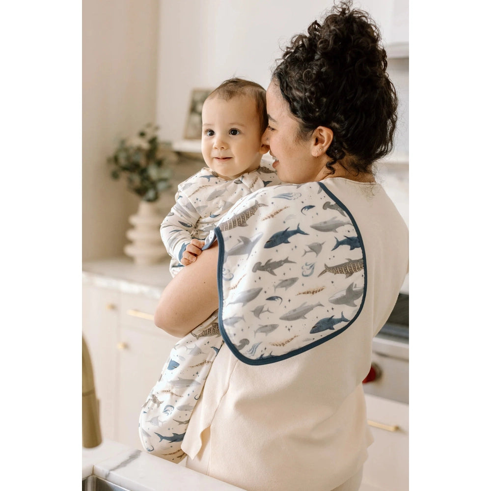 Loulou Lollipop burp cloth set with blue shark print, pictured on mother and baby
