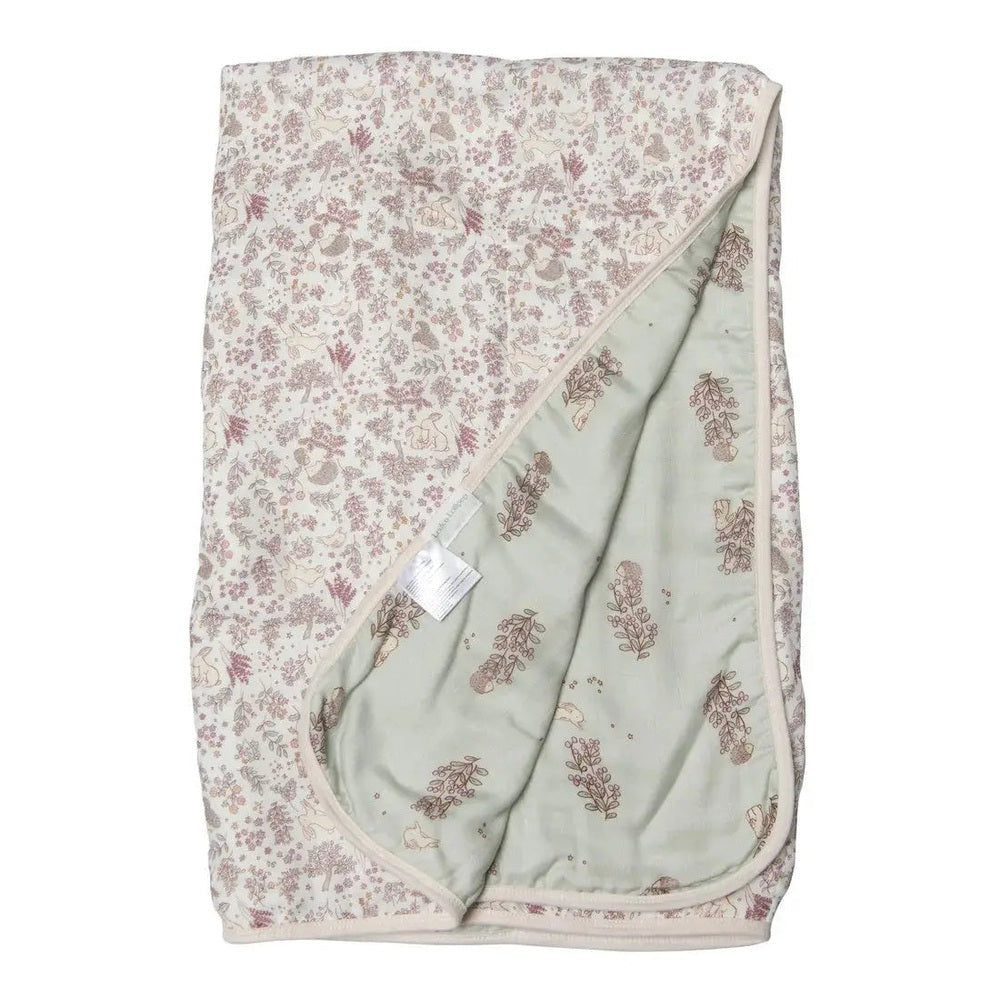 Loulou Lollipop Muslin Quilt Blanket, ivory pink floral top with mint-green reverse folded to reveal soft fabric.