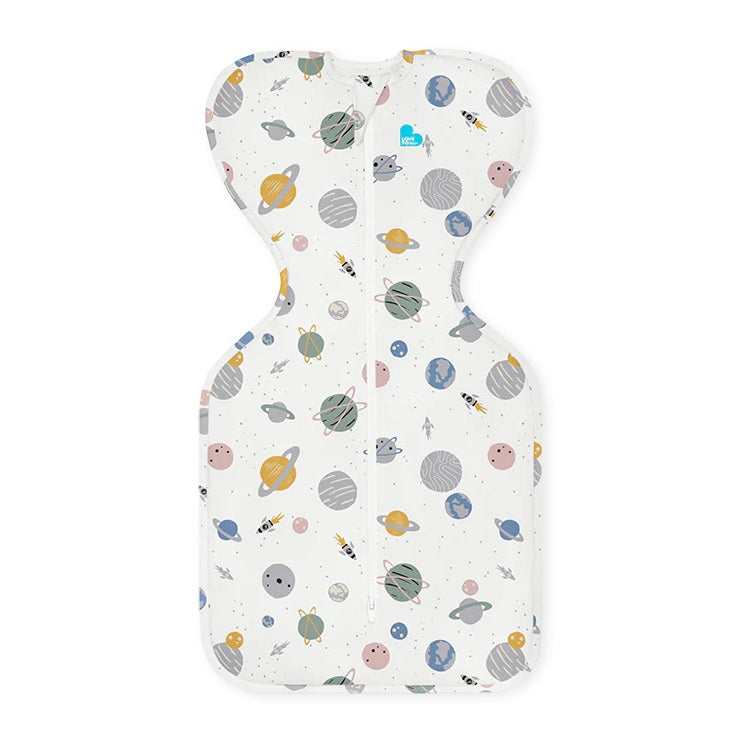 Love To Dream Swaddle Up Cotton 0.2 Tog Rocket White Space swaddle laid flat with space-print fabric and front zipper