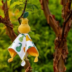 Mary Meyer Sweet Soothie Pear plush pacifier toy with pear-printed blanket hanging from a branch