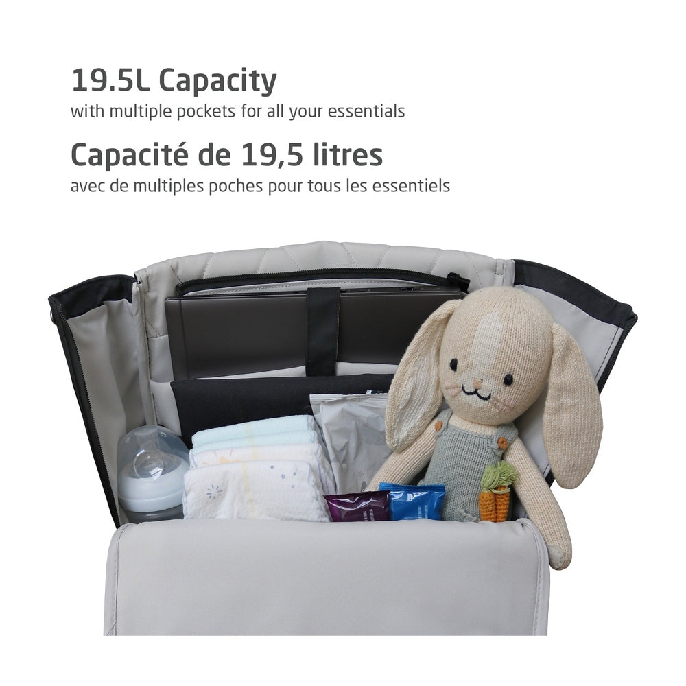 MAXI COSI Changing Backpack in gray, opened to reveal 19.5L capacity and multiple pockets with baby essentials.
