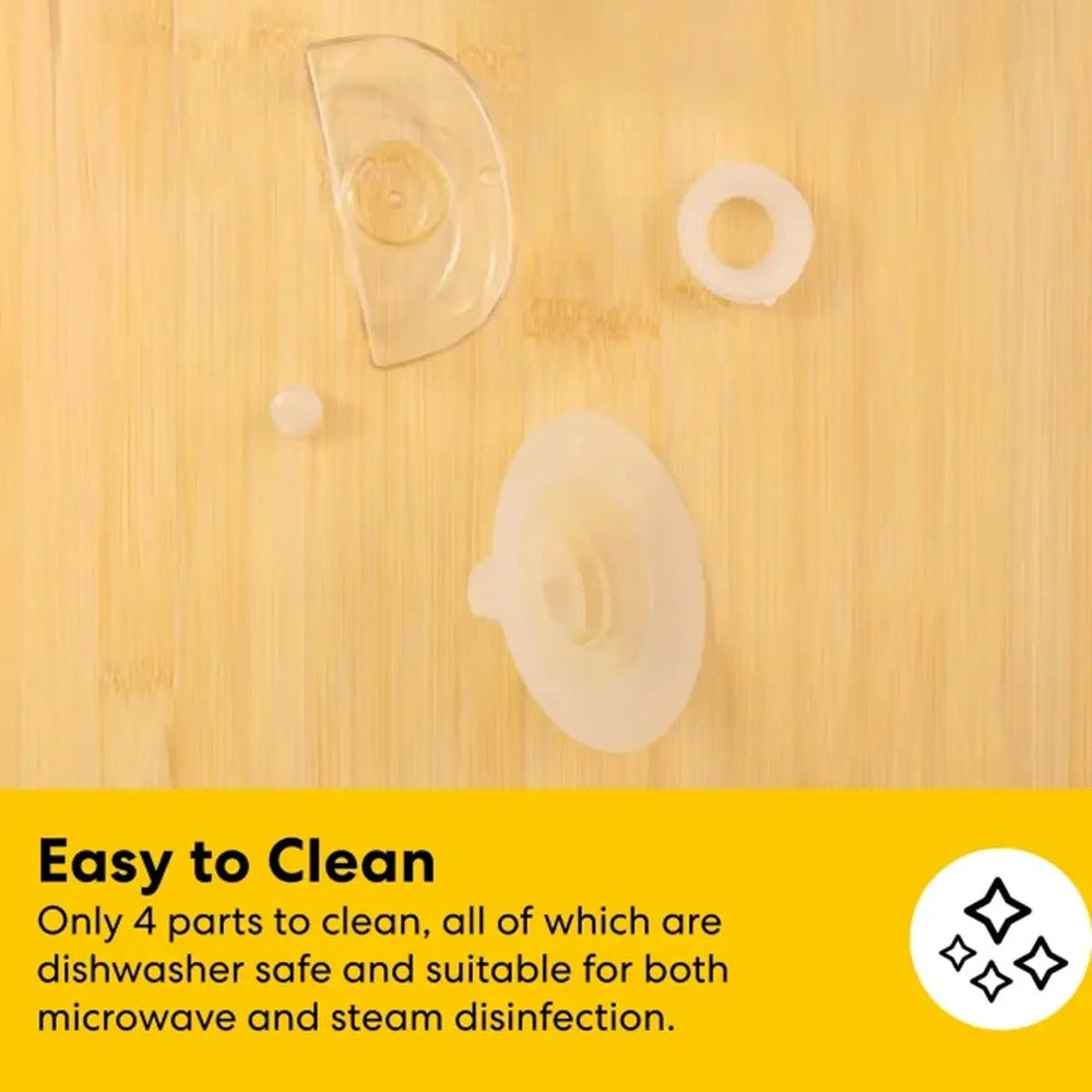 MEDELA Melody InBra Double Electric Breast Pump parts arranged on wood surface for easy hands-free pumping.