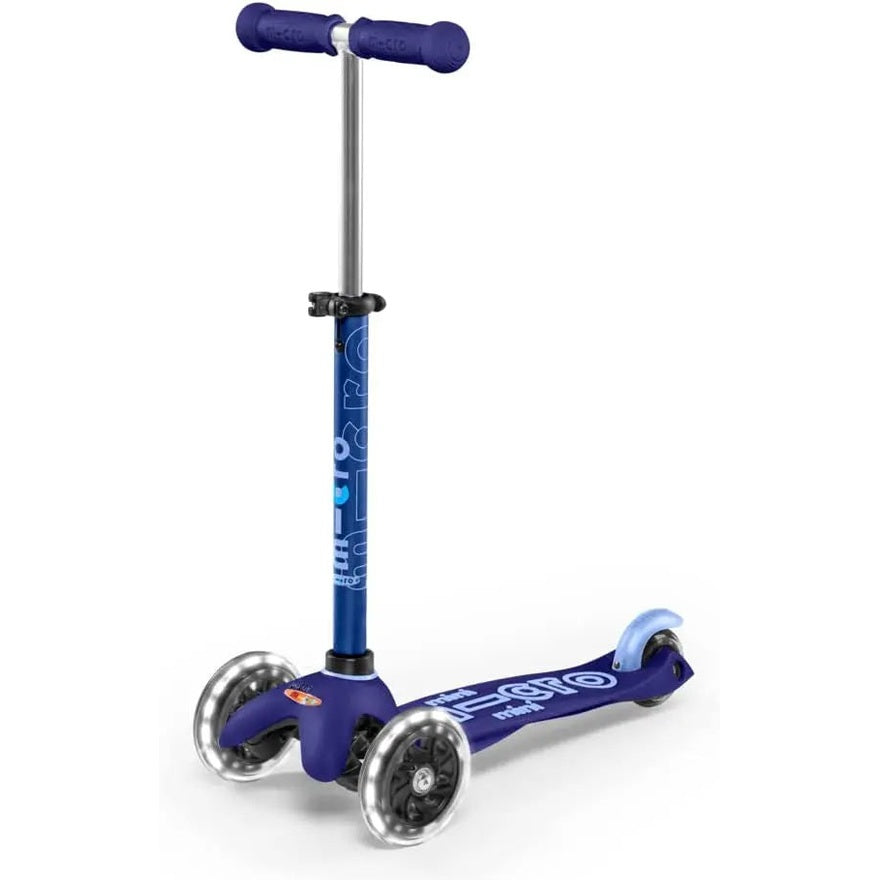Micro Mini Deluxe LED Scooter in blue with LED wheels and T-bar handle on a three-wheel deck.