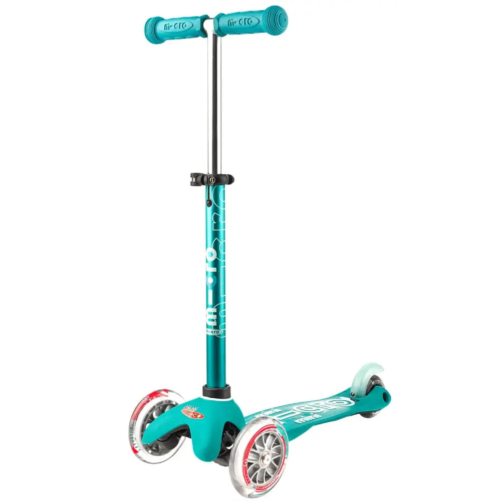 Micro Mini Deluxe Scooter turquoise three-wheel kids scooter in upright stance with teal handlebars, deck, and wheels.