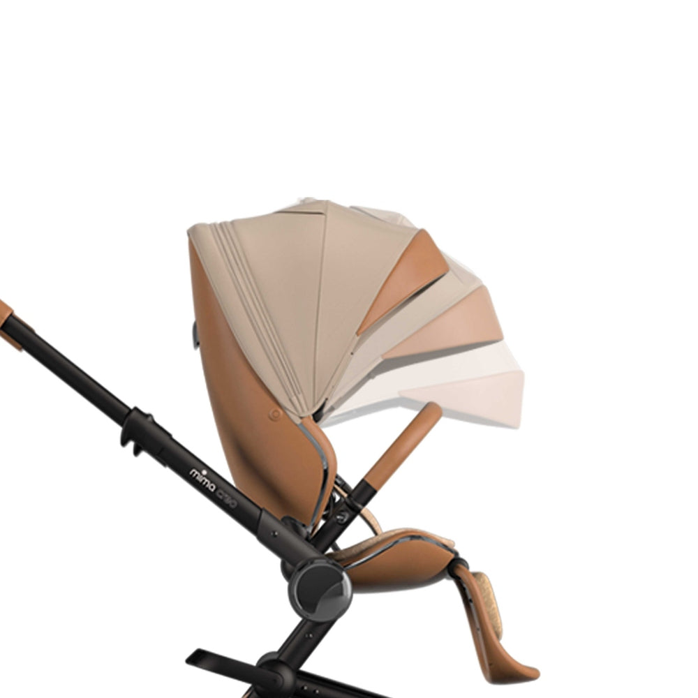 Mima Creo Stroller in beige-tan seat and canopy, black frame with extended sun canopy.