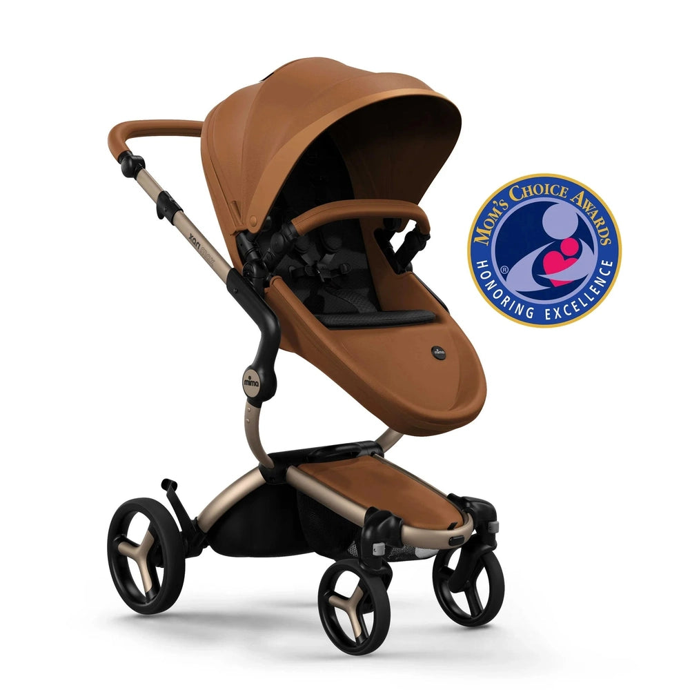 Mima Xari Max Stroller in brown with tan frame, canopy extended over seat on a sleek 4‑wheel chassis.