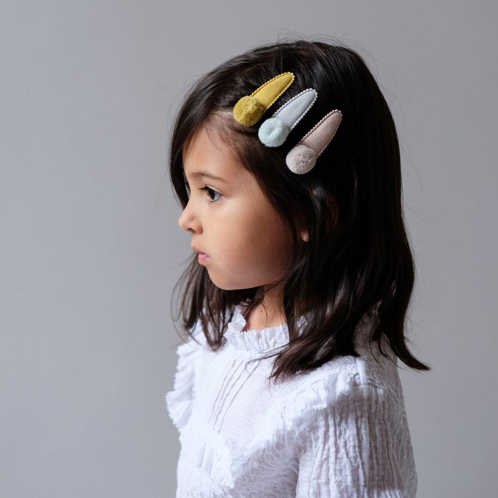 Mimi & Lula Pom Pom Mabel Clips: four pastel Nordic hair barrettes in mustard, blue, beige and ivory