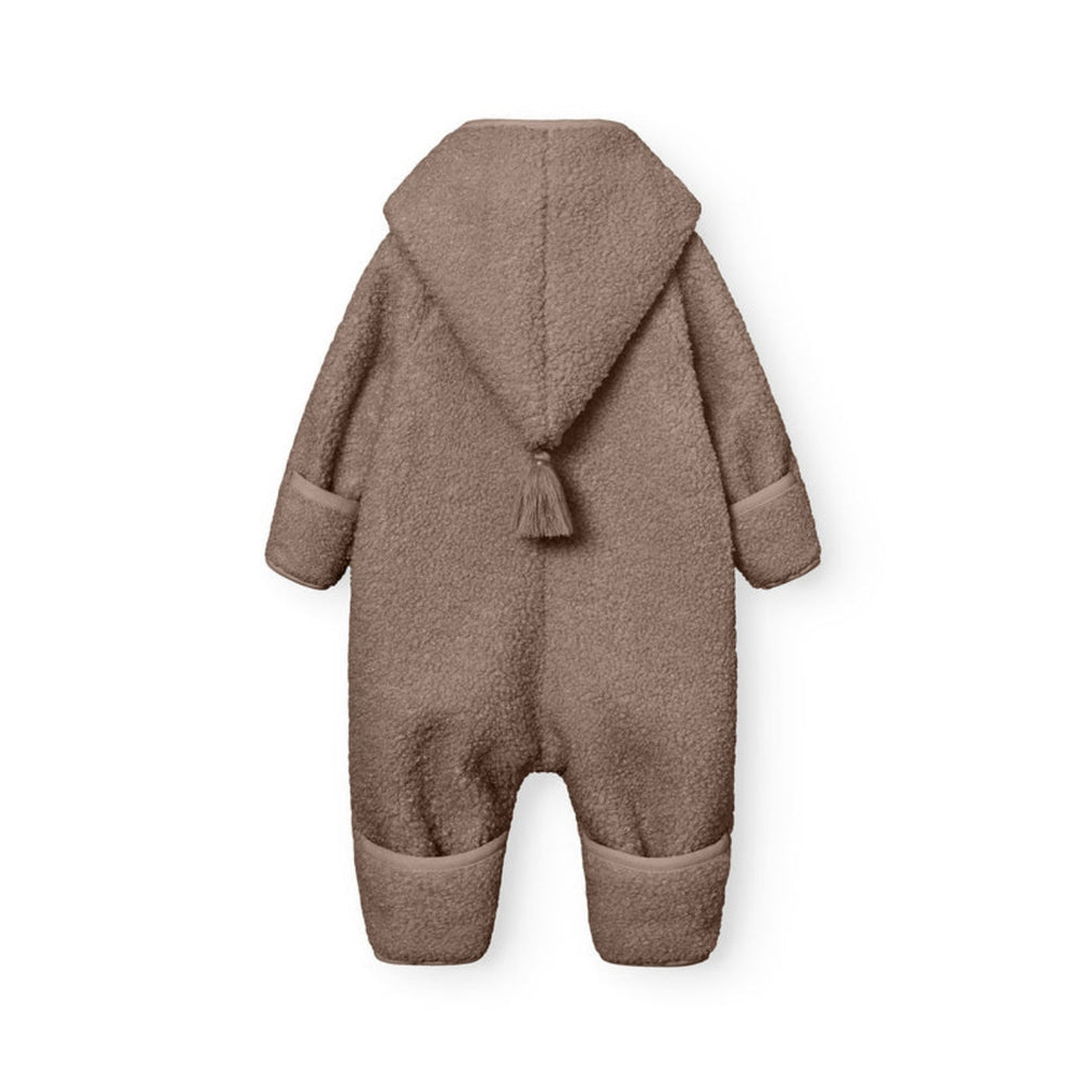 MINI A TURE Matadel teddyfleece jumpsuit in grey-brown with hood and tassel.