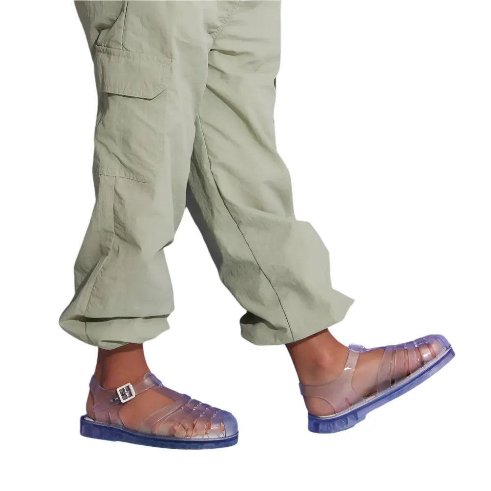 MINI MELISSA Possession Sandal Clear Glass for kids; transparent purple jelly straps buckled as a child walks.