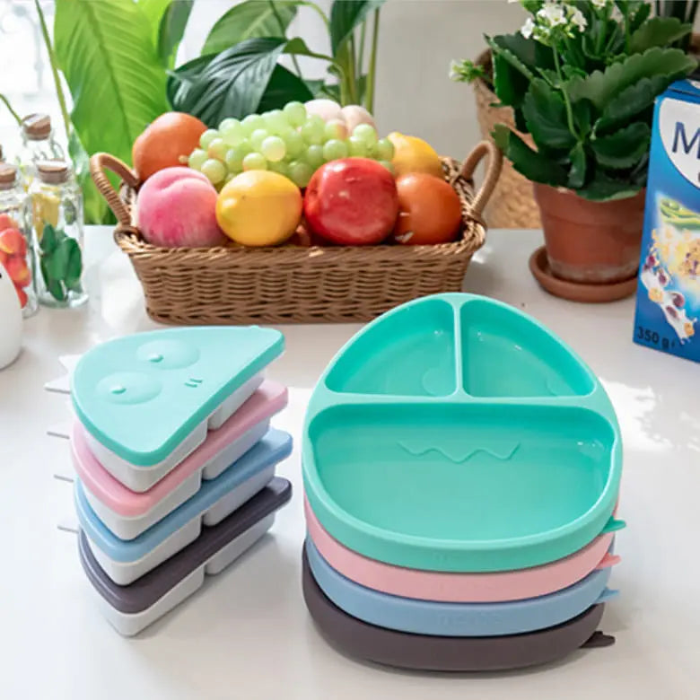 Monee Dinosaur Food Plate Combo teal divided feeding plate with compartments; pastel stackable trays shown beside.