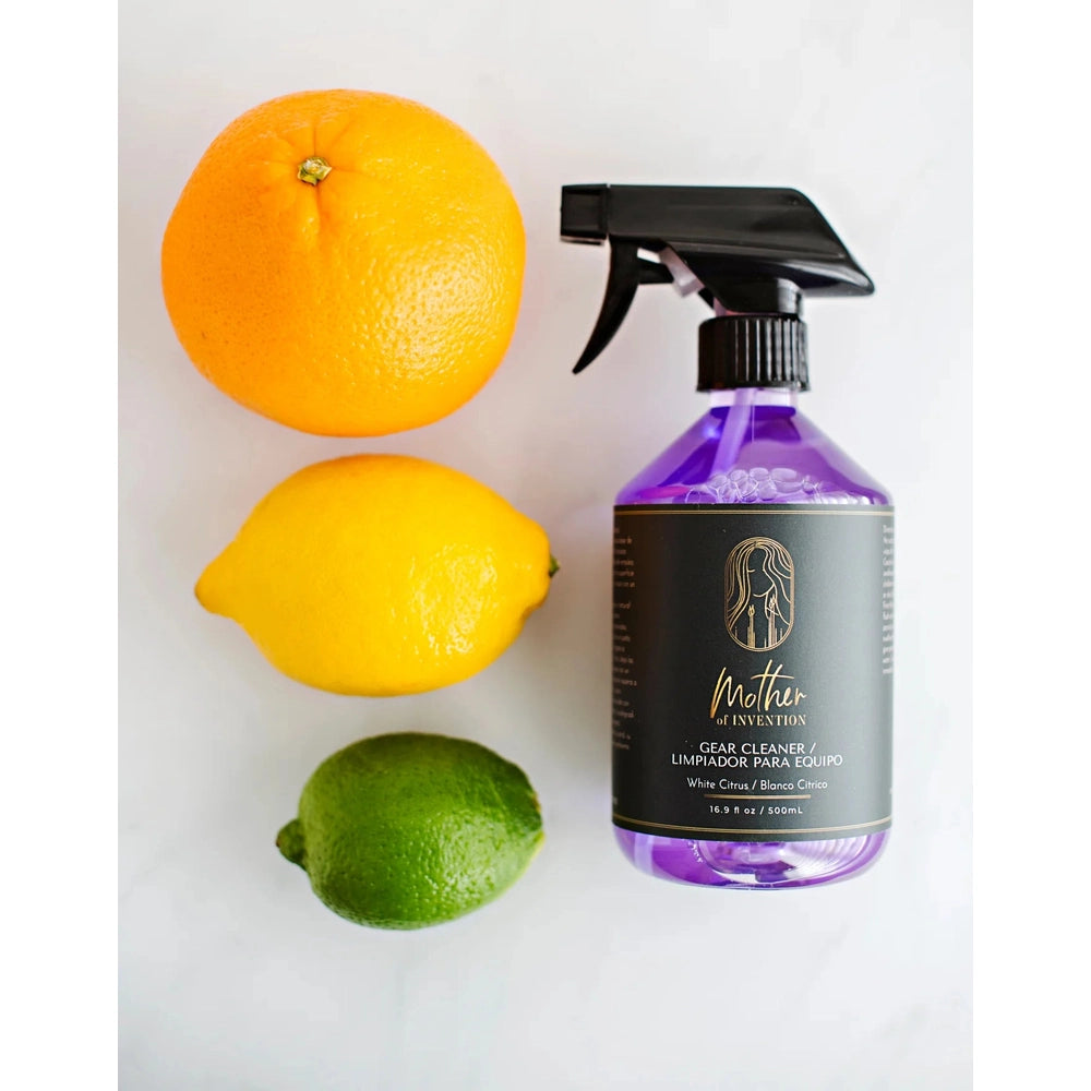 Mother Of Invention multi-purpose cleaner 500 ml spray bottle with purple liquid beside orange, lemon, and lime trio