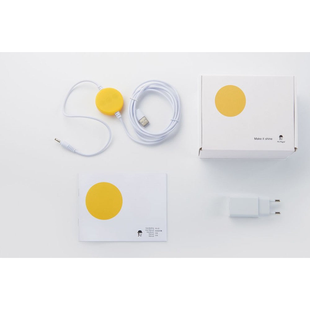 Mr Maria First Light Lion night light kit with yellow circle motif, USB cable, adapter, and manuals