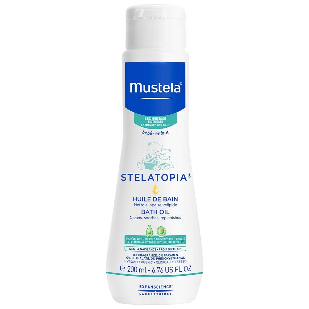 Mustela Stelatopia Bath Oil 200 ml bottle, white container with blue label, standing upright for extremely dry skin care.