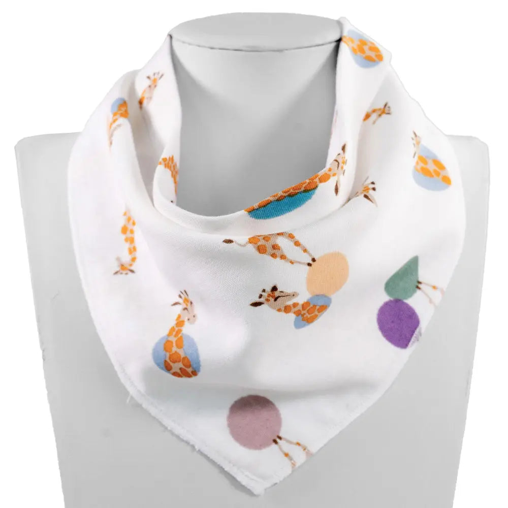 baby bandana bib, white with orange giraffes and pastel shapes, bamboo, one size