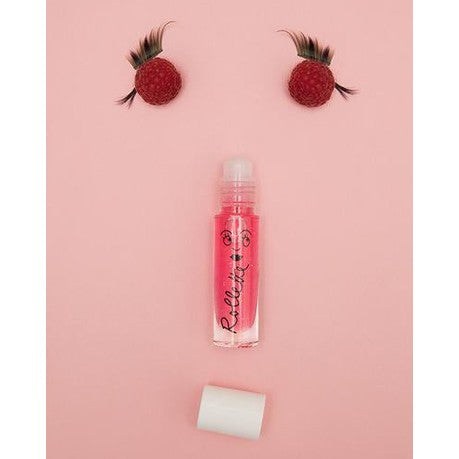 Nailmatic Raspberry Rollette lip gloss bottle in pink with white cap, cosmetics