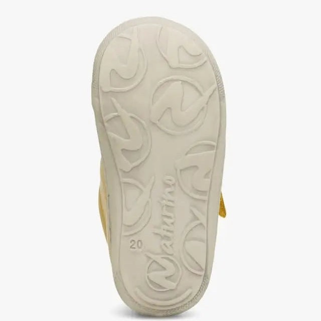 Naturino Cocoon Vl Yellow baby sandal; cream outsole with circular tread and yellow strap visible.