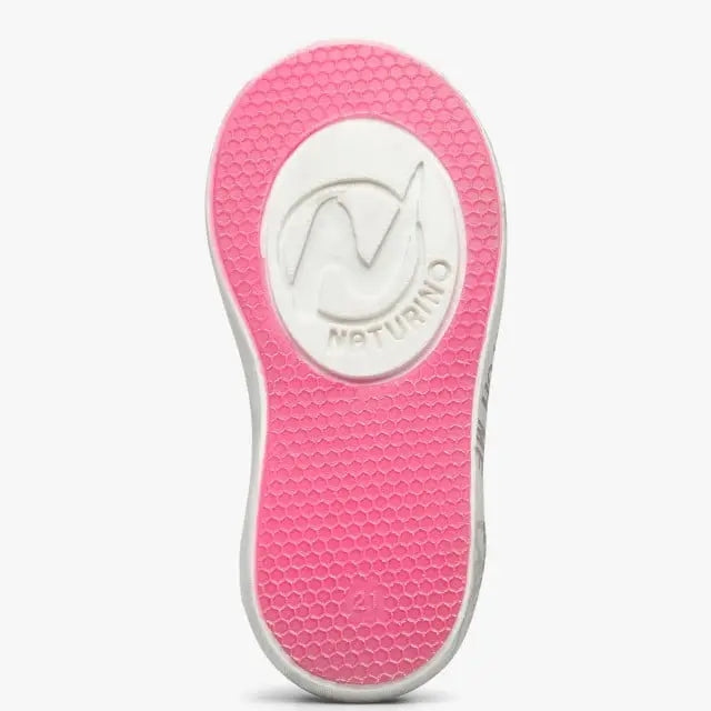 Naturino Kristil Vl toddler shoe in pink and white, showing a textured pink sole with brand logo.