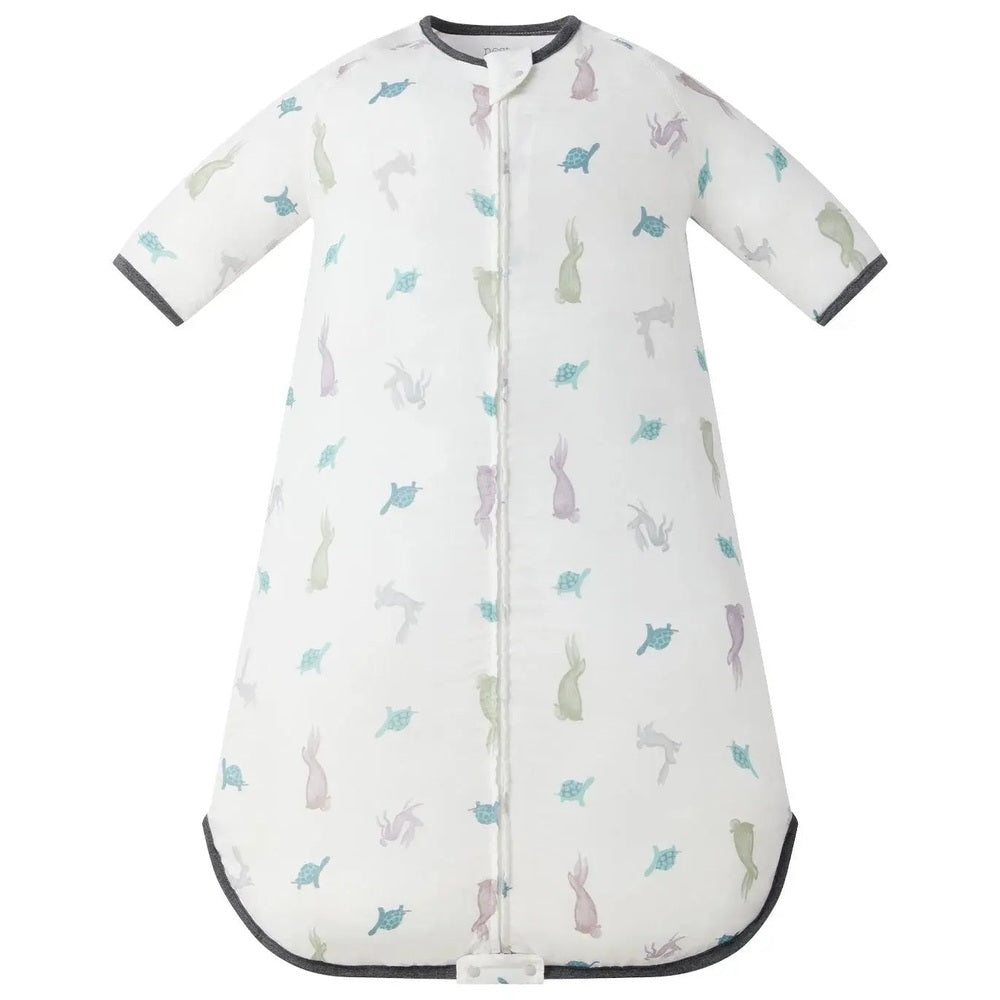 Nest Designs 0.23 Tog Bamboo Sleep Bag The Tortoise & The Hare, white with pastel tortoise/hare print, zipper front, 3/4 sleeves.