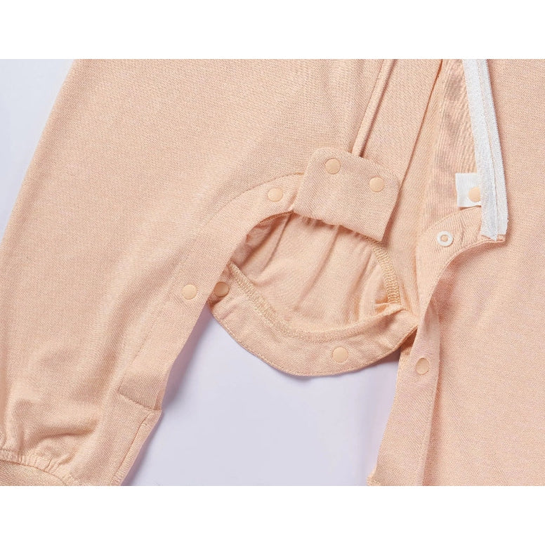 Nest Designs bamboo jersey footed sleep bag in Pantone Bellini peach, 0.5 tog, with snap closures