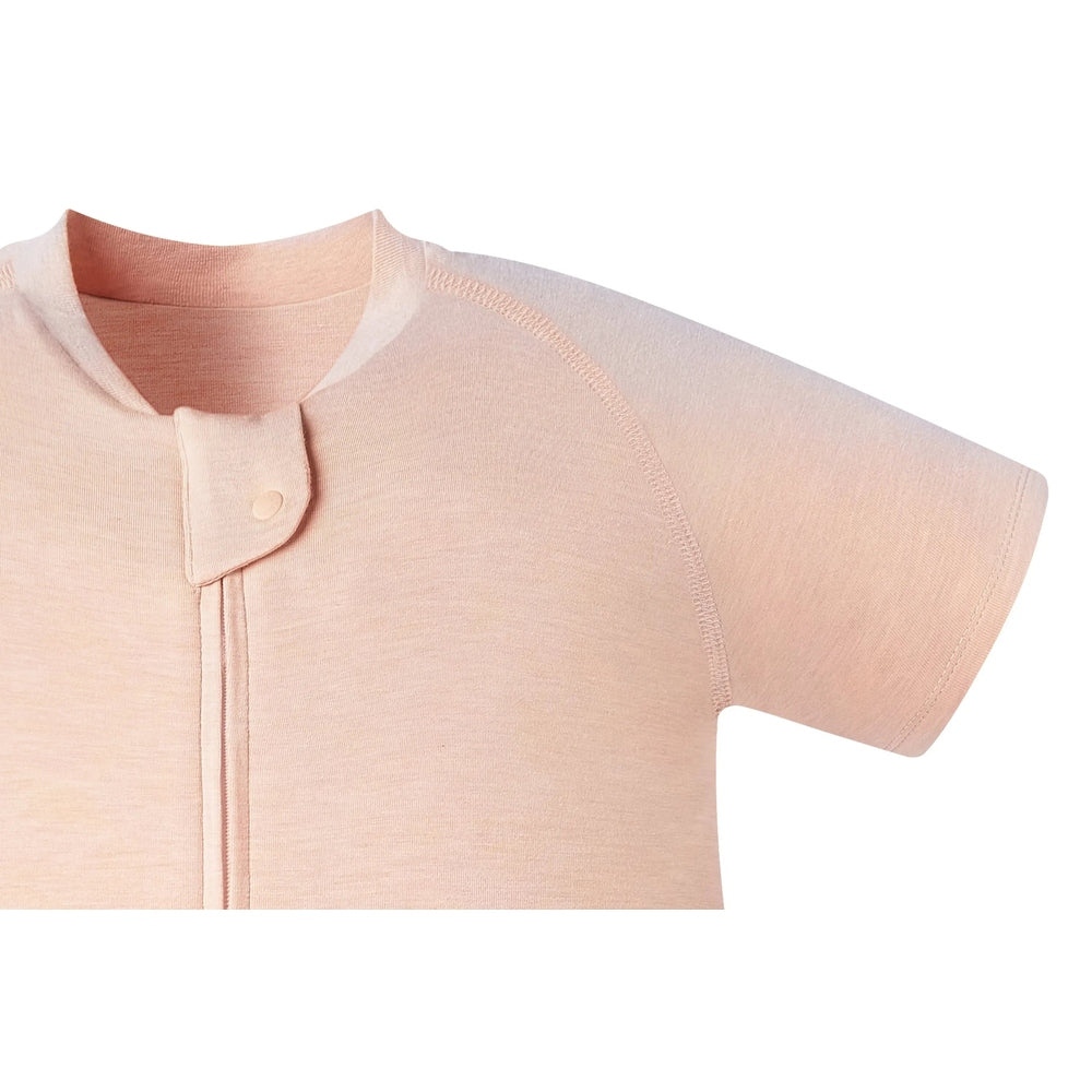 Nest Designs Bamboo Jersey Short Sleeve Footed Sleep Bag Pantone Bellini pink; front snap placket shows easy fastening.