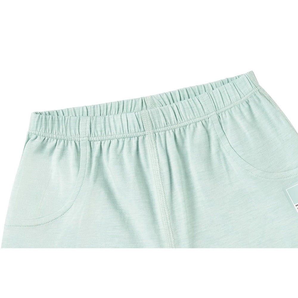 Nest Designs Bamboo Jersey Shorts Pantone Harbor Grey, elastic waistband and side pockets shown in relaxed lounge style