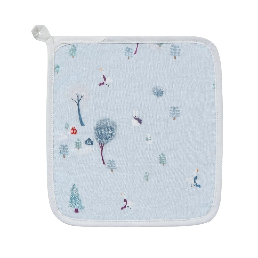 Nest Designs Bamboo Muslin Small Nesting Blanket in light blue with white trim, patterned with trees and small figures.