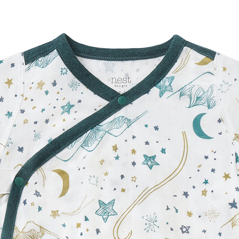 Nest Designs Bamboo Short Sleeve Kimono Onesie Stars White with teal trim and green snaps along the wrap front.